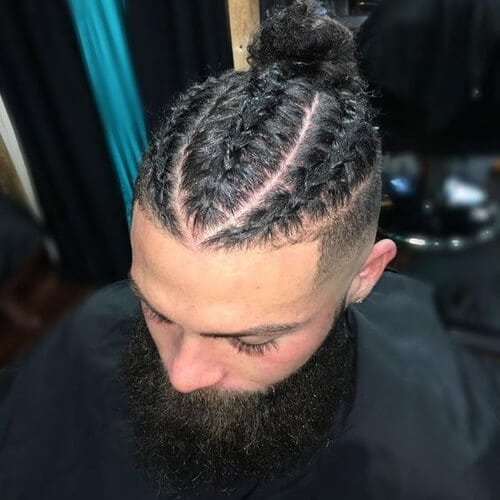 man at barber with high and tight and braids