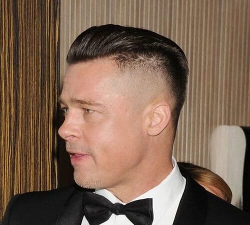 brad pitt wearing a suit and a bowtie, with a high and tight sleek haircut