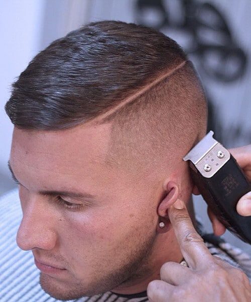 man having a high an tight haircut