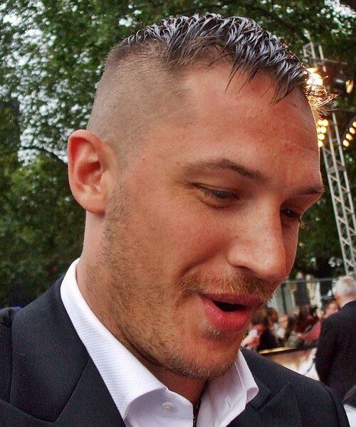 tom hardy in a suit and a prohibition High and Tight hairstyle