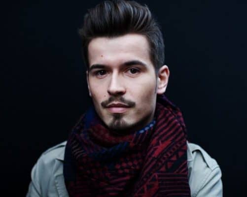 Man with goatee and fluffy scarf