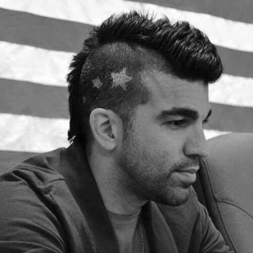 guy with star shaped hair tattoo