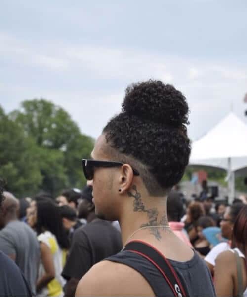 curly man bun shaved underside hipster hairstyles