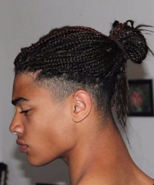 braids in a man bun hairstyle
