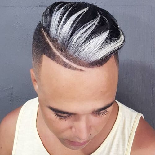 A man looking down with his frosted tip layered haircuts