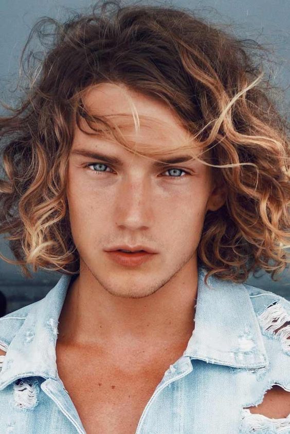 Androgynous man with Shaggy Highlights jewfro hairstyle
