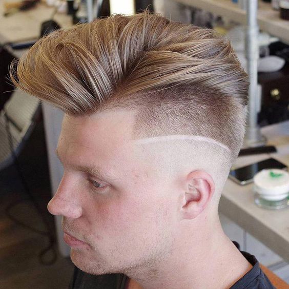 aggressive asymmetrical quiff with decal and diagonal part