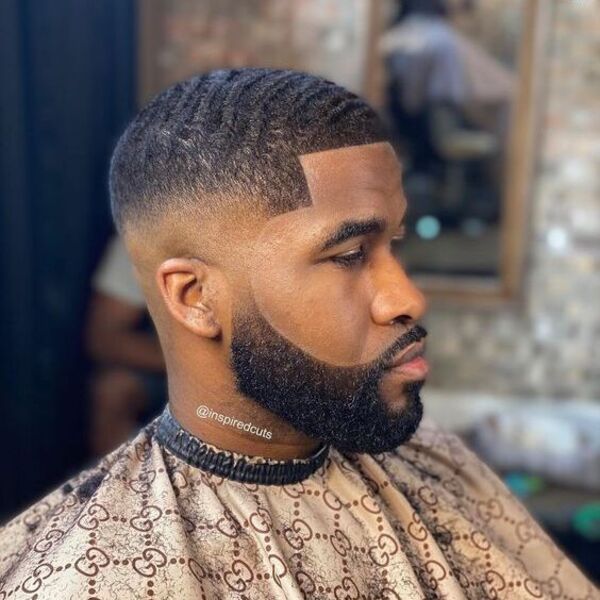 Afro Professional Hairstyles for Men- a man had his Afro Hairstyle with beard