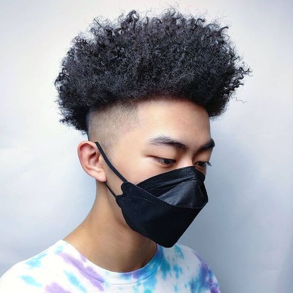 Blowout Side Fade Afro - a man had his Blowout Side Fade Afro with mask