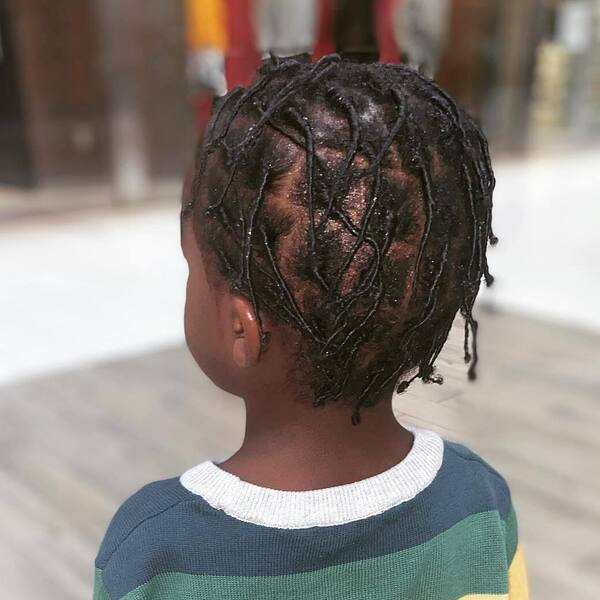 Braided Tail Toddler Boy Haircuts -A boy had his Braided tail cut wearing stripes sweater