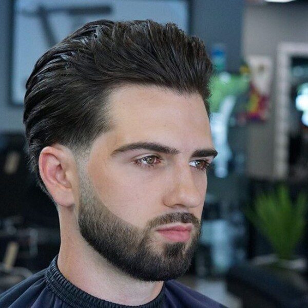 Brushed Layered Haircut - a man had his Brushed Layered Haircut with beard