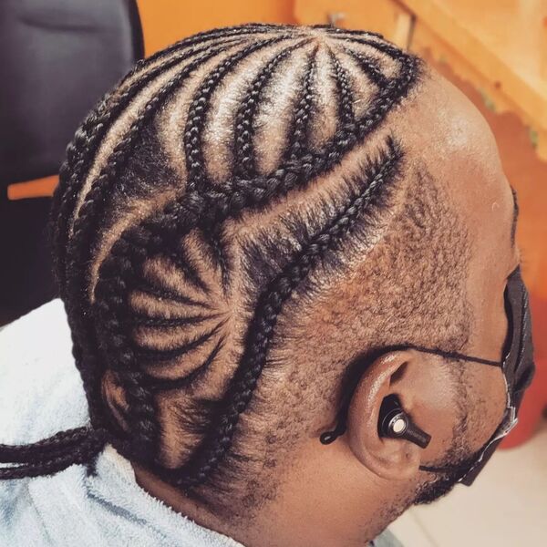 Cornrow Braids Hairstyle for Men - a man had his cornrow style wearing a mask