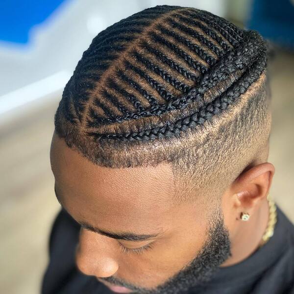 FishBone Cornrow Hairstyles for Men - a man had his hair braid wearing a gold necklace