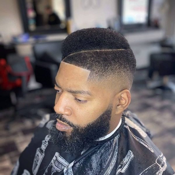 High Top Fade with Juice Haircuts for Men - a man had his High Top Fade with Juice with beard