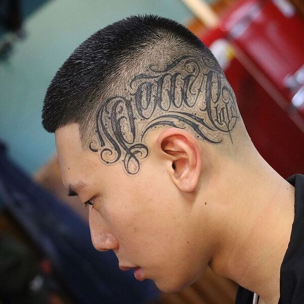 Juice Haircuts for Men with Fade and Tattoo - a man had his Juice Fade with Tattoo with shirt