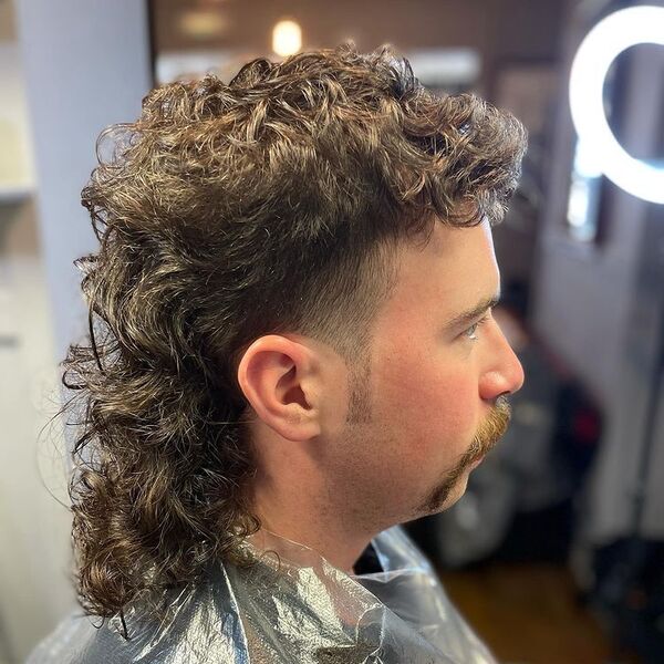 Long Curly Hair Mullet - a man had his Long Curly Hair Mullet with beard