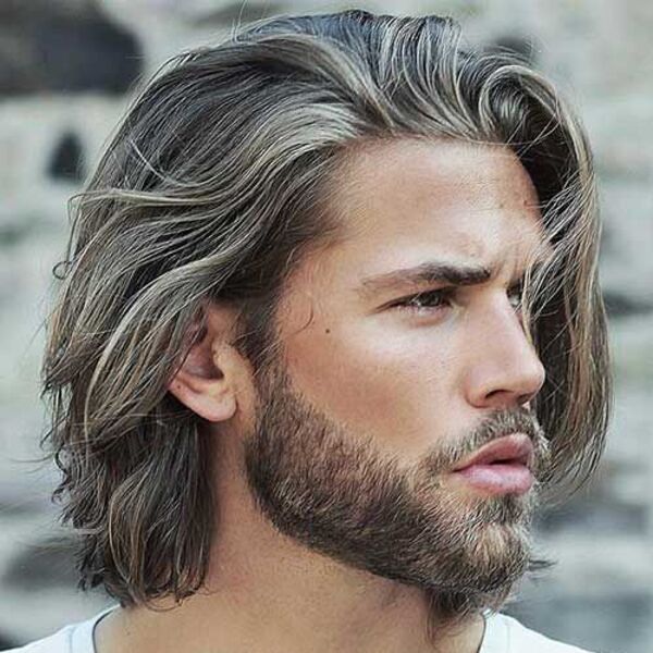 Long Flow Hair Professional Hairstyles for Men - a man had his Long Flow Hair with beard