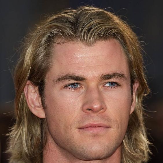 a man had Loose Bun Haircut style - Chris Hemsworth Haircuts