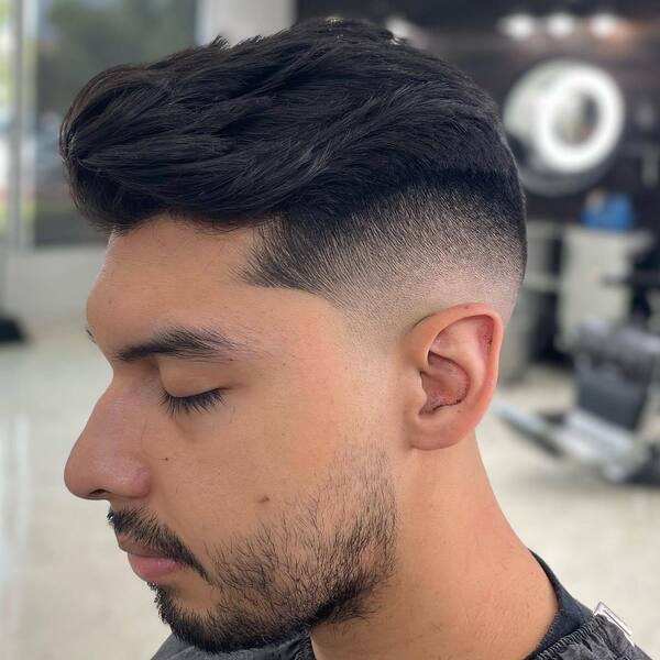 Mid Fade Comb Over Taper Haircuts for Men - a man had his Mid Fade Combover with mask