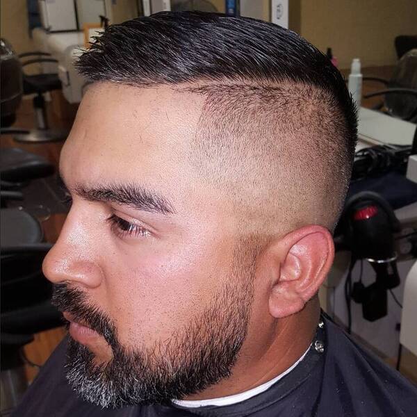 Side Part Comb Over Taper Haircuts for Men - a man had his Side Part Combover Haircut with beard