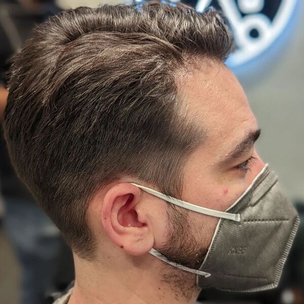 Textured Comb Over Taper Haircuts for Men- a man had his Textured Combover Haircut with mask