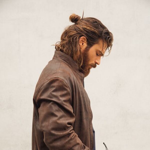 Textured Hair Ponytail Hairstyles for Men - a man had his Textured Hair Ponytail with beard