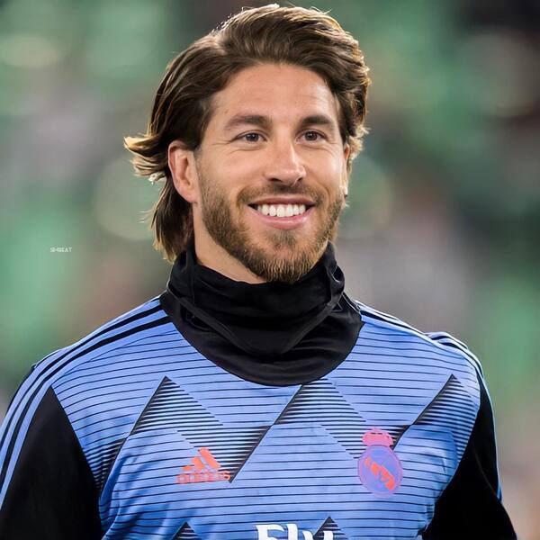 Blown Out Side Part with Beard- Sergio Ramos wearing a blue sports jacket