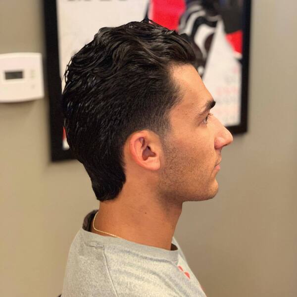 Comb Over Mullet with Tapered Cut- a man wearing a gray t-shirt Baseball Haircuts