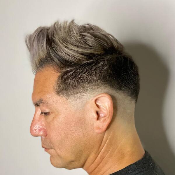 Faux Hawk with Blonde Fade- a man wearing a black t-shirt