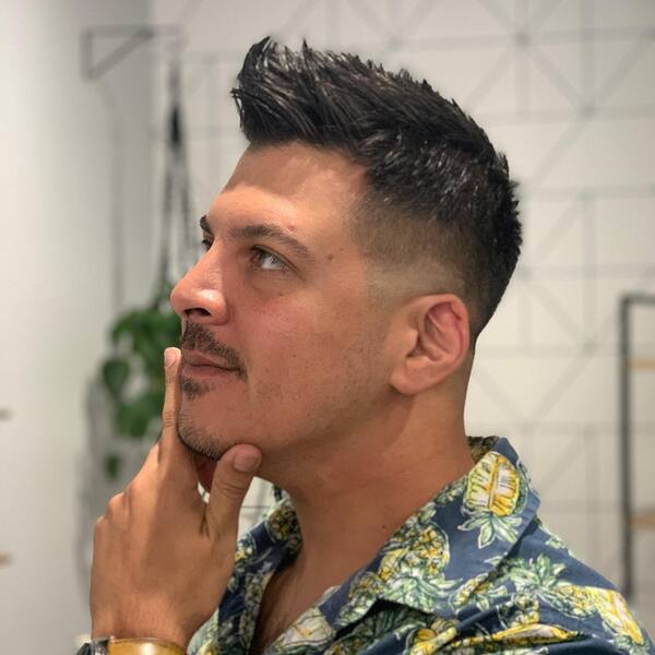 Layered Faux Hawk Fade- a man wearing a floral polo