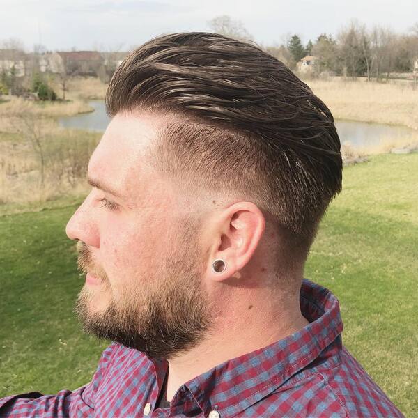 Pompadour with Low Fade- a man wearing a checkered long sleeves Baseball Haircuts