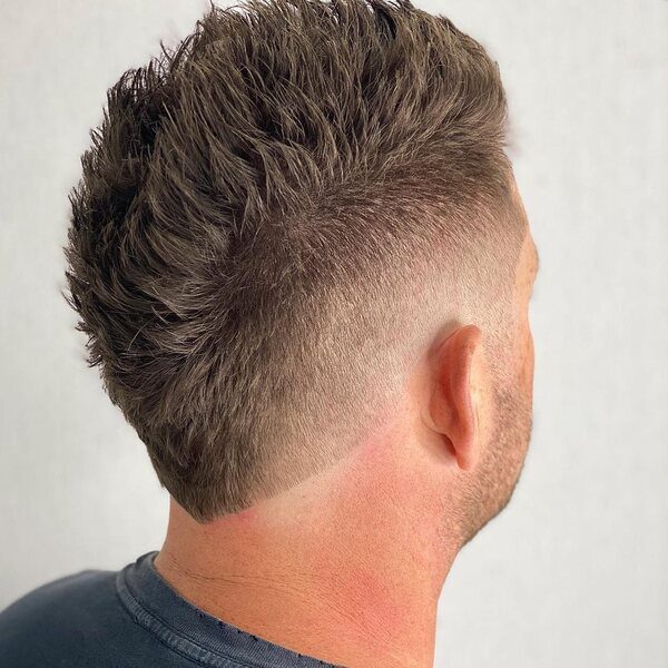 Spiky Faux Hawk with Low Fade- a man wearing a black t-shirt