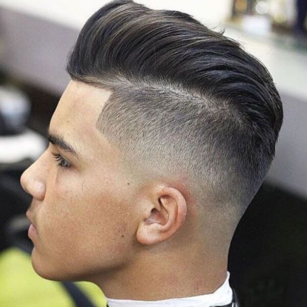 a side view look of a man with his geometrical disconnected undercut 