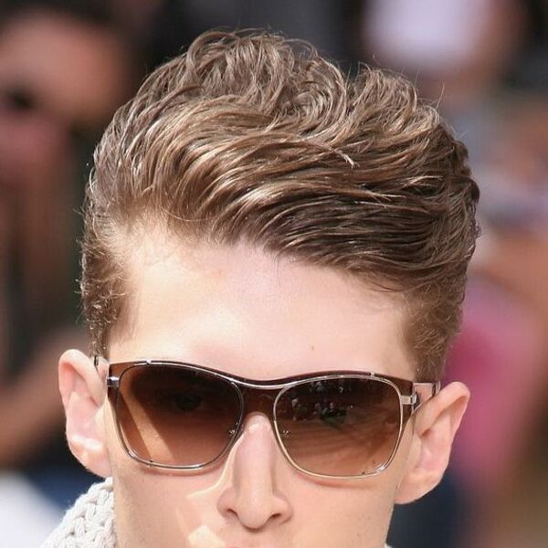 a man wearing sunglasses with his 80s hairstyles for men rush brush slicked back hair